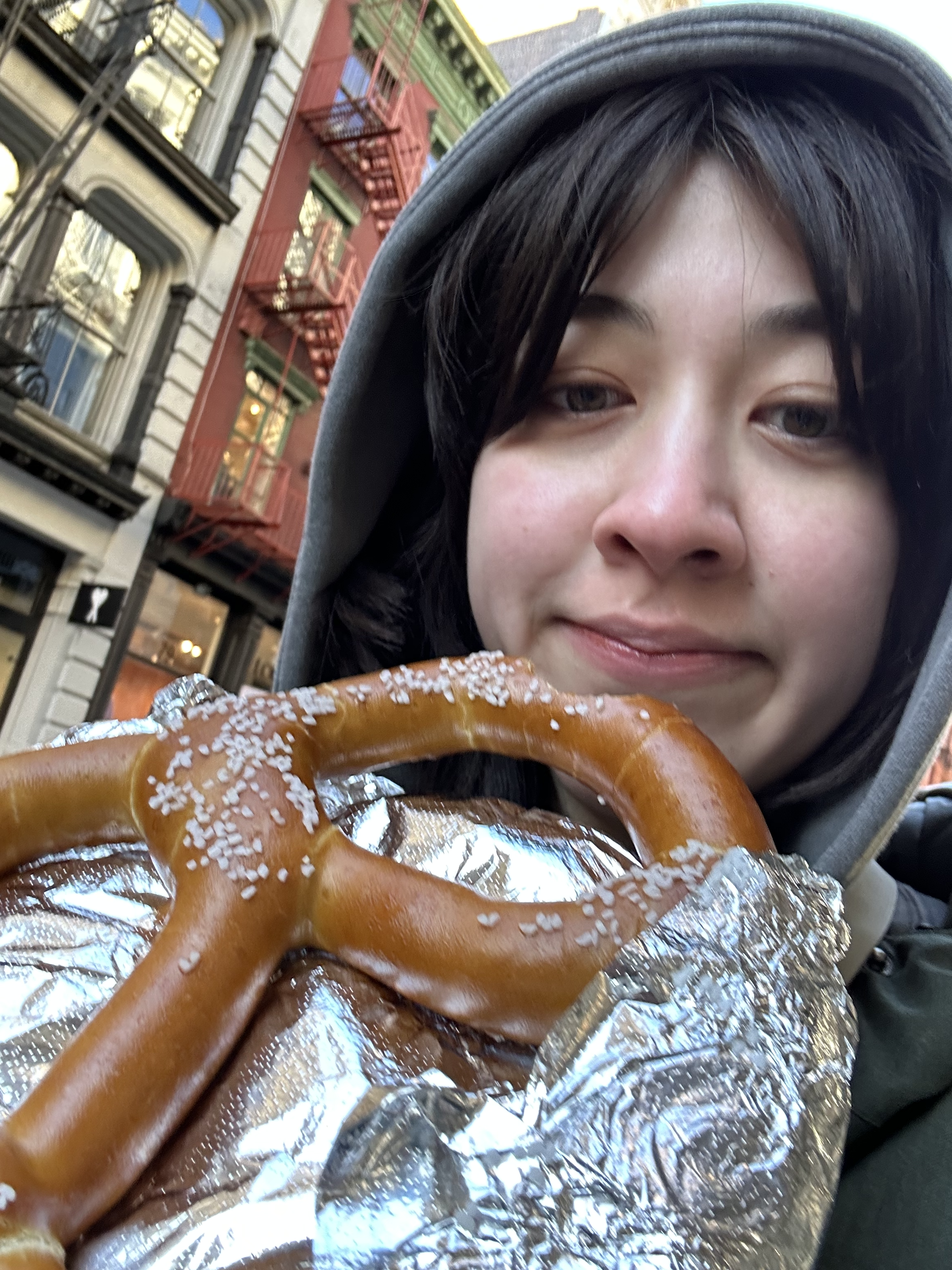 A picture of me with a pretzel I got the one time I went to New York.